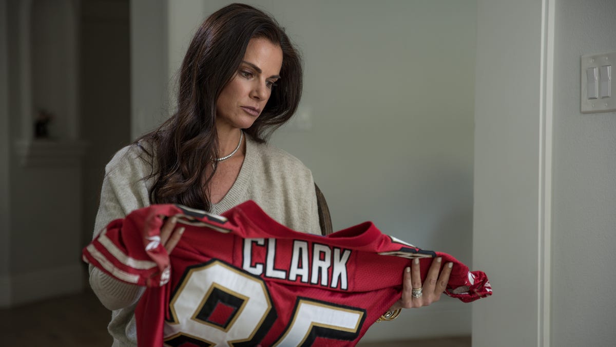 Apr 13, 2022; Danville, Ca. 94506, USA; April 13, 2022; Danville, Calif.     Carie Clark, 47, is photographed with her husband's NFL jersey at her home in Danville, Caliornia on Wednesday, April 13, 2022. She is the widow of Greg Clark, the former NFL player who after killing himself last year was found to have been suffering from C.T.E. The brain study results recently became final. We meet his family. 12:30 pacific time.. Mandatory Credit: Martin Klimek-USA TODAY [Via MerlinFTP Drop]
