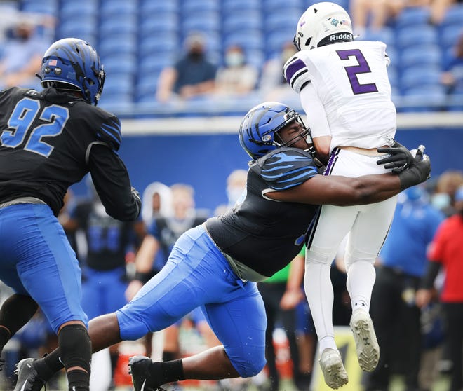 Memphis defensive lineman Kajuan Robinson tackles Stephen F. Austin quarterback Trae Self during their 2020 game at Liberty Bowl Stadium. Robinson is one of three new transfer players joining Texas State; he has three years of eligibility left.