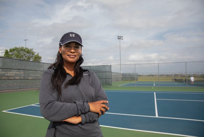 Hendrickson tennis coach Teri Saunders takes a break from practice on the school's courts last week. Saunders has rejuvenated the Hawks' tennis program in her two seasons on campus, and she'll guide the girls doubles team of Idara Udiok and Bella Reusch into this week's UIL state tennis tournament.