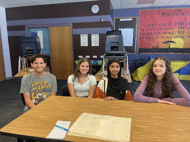 Jacksonville middle school students, from left to right, Kai Albough, Mary Elizabeth Everson, Sara Bhonhariya, and Jessie Olan are making a huge impact and sharing their voices for the children of Ukraine.