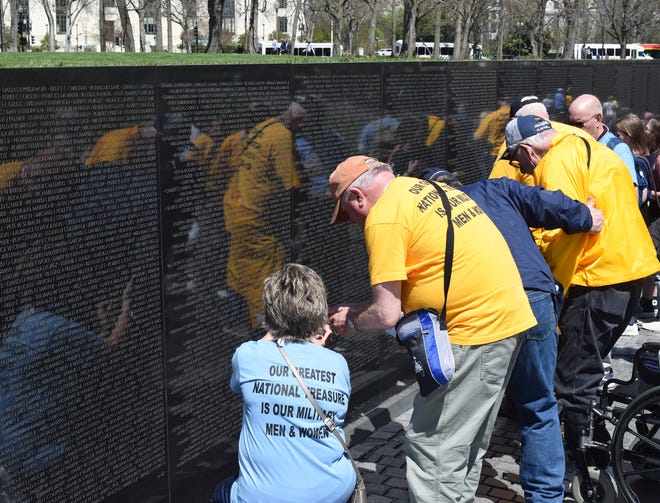 At the most recent Honor Flight, veterans and guardians scanned the Vietnam Memorial Wall looking for names of people they knew.