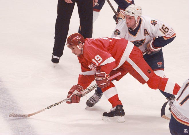 Detroit Red Wings' Steve Yzerman battles St. Louis Blues' Brett Hull during Game 4 of the first round playoff series at the Kiel Center in St. Louis, April 22, 1997.