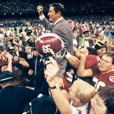 Gene Stallings is lifted up by his players after t