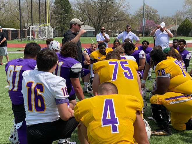 Kansas Wesleyan football coach Matt Myers speaks with his team after an intersquad scrimmage Saturday, April 23, 2022 at Graves Family Sports Complex.