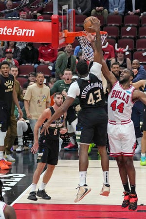 Bucks forward Thanasis Antetokounmpo's dunk over the Bulls' Patrick Williams went viral.