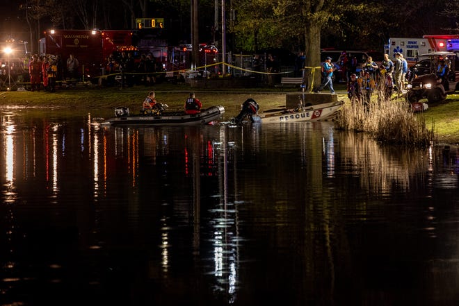 Members of several fire departments and emergency response teams search Hardcastle Pond in New Milford for reports of a missing man April 22, 2022.