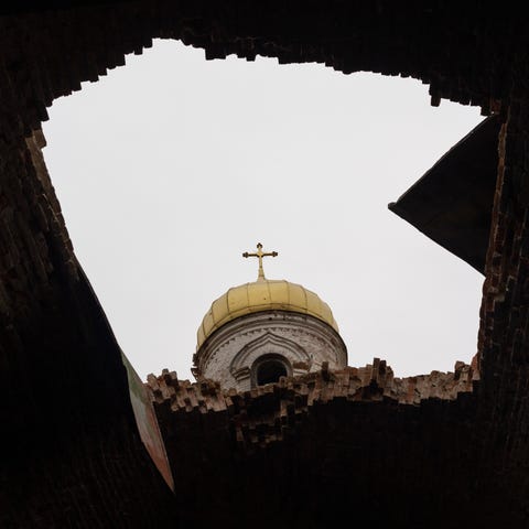 A hole in the roof of a damaged church, in Lukashi