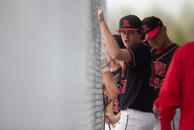 Rossville players listen to coaches from the dugout during Friday's game against Santa Fe.