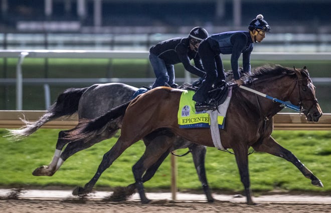 Kentucky Derby favorite, Epicenter, works out with a stable mate before dawn at Churchill Downs. April 24, 2022