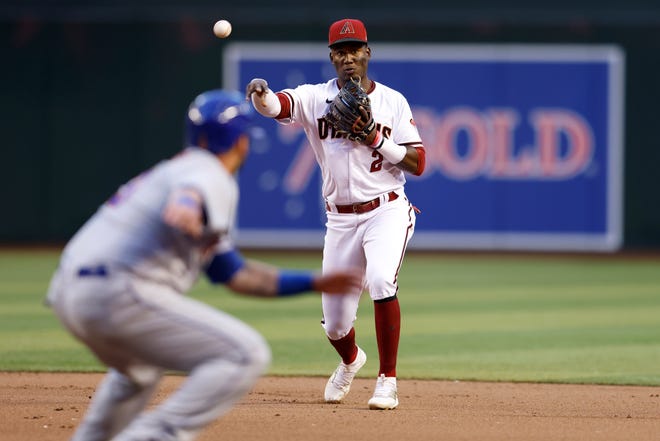 Geraldo Perdomo #2 of the Arizona Diamondbacks throws to first base for an out during the fifth inning against the New York Mets at Chase Field on April 23, 2022 in Phoenix, Arizona.