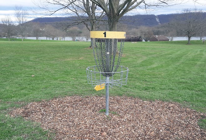 Similar to the holes in golf, disc golf has baskets for participants to throw their discs toward.
