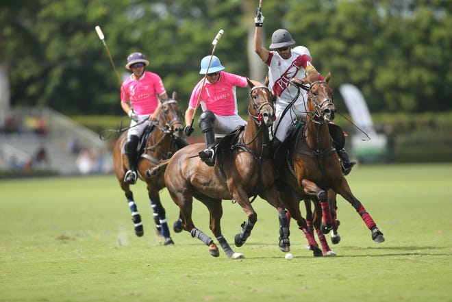 Juan Martin Obregon of La Elina (left) battles MVP Facundo Pieres of Pilot for possession of the ball during Sunday's U.S. Open at International Polo Club Palm Beach.