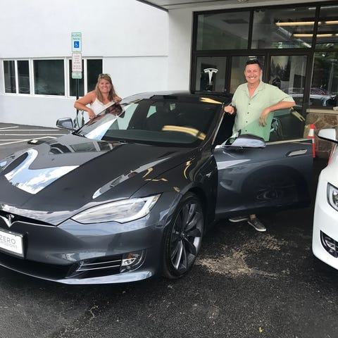 Lori and Matthew Brown picked up their Tesla Model