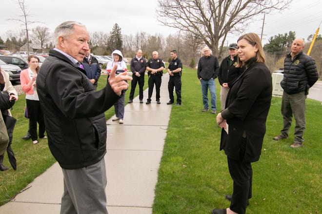 Putnam Township Supervisor Dennis Brennan, left, talks on Monday, April 25, 2022 with U.S. Rep. Elissa Slotkin about the multi-modal pathway that Congress approved $2 million to fund. A group of Pinckney Village and Putnam Township officials, representatives from the Department of Natural Resources, police and fire department personnel assembled near Pinckney Community High School on Dexter-Pinckney Road to discuss the accomplishment.