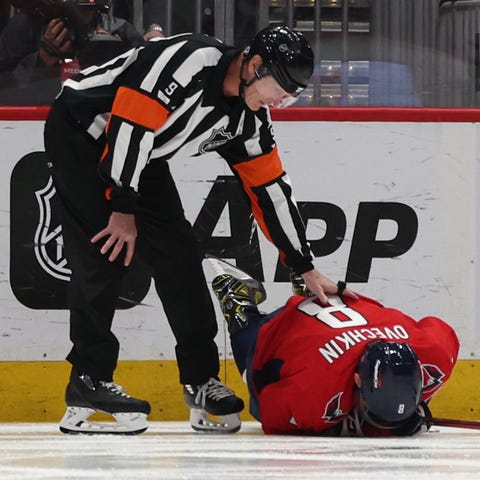 Alex Ovechkin lays on the ice injured during Sunda