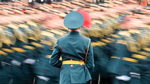 TOPSHOT - Russian servicemen march along Red Squar