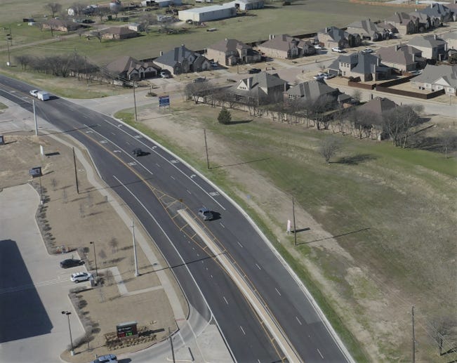 A view of southbound FM 663 with a left-turn and deceleration lane as it approaches Autumn Run Drive near the Kroger shopping center. The city of Midlothian recently updated its impact fee schedule to help pay for roadway, water and wastewater improvements. The new fees go into effect Oct. 1.