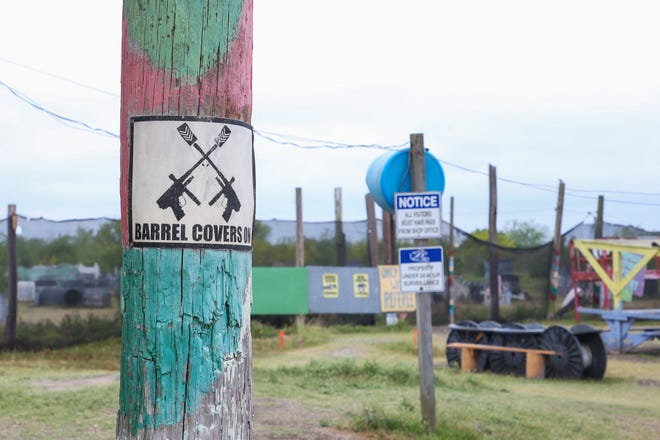 A sign at Play Extreme Sports lets players know to keep their barrel covers on when playing a round of paintball. The local business is open on the weekends and by reservation during the weekdays.
