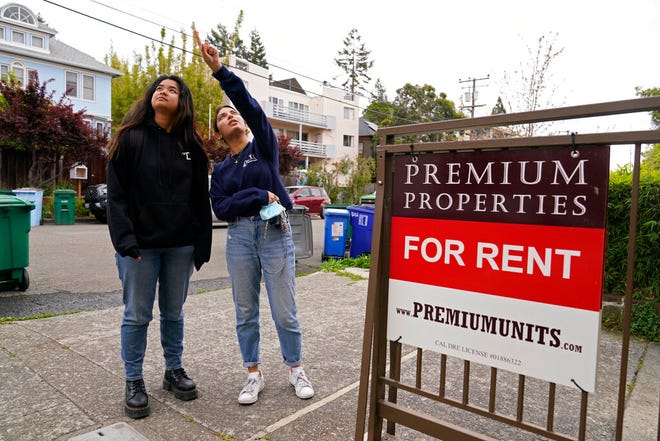 University of California, Berkeley freshmen Sanaa Sodhi, right, and Cheryl Tugade look for apartments in Berkeley, Calif., Tuesday, March 29, 2022.
