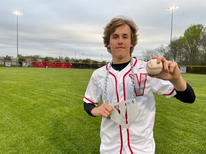 Vineland junior Anthony Rakotz shows off his Player of the Game chain and the ball he smashed over the left-field fence as his walk-off homer lifted the Fighting Clan past Millville 4-3 in 10 innings on April 25.