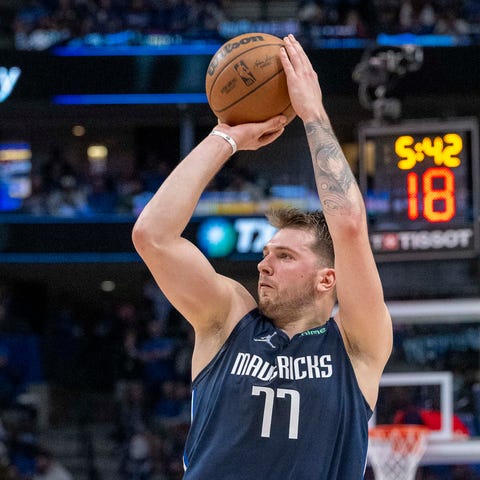 The Dallas Mavericks' Luka Doncic shoots against t