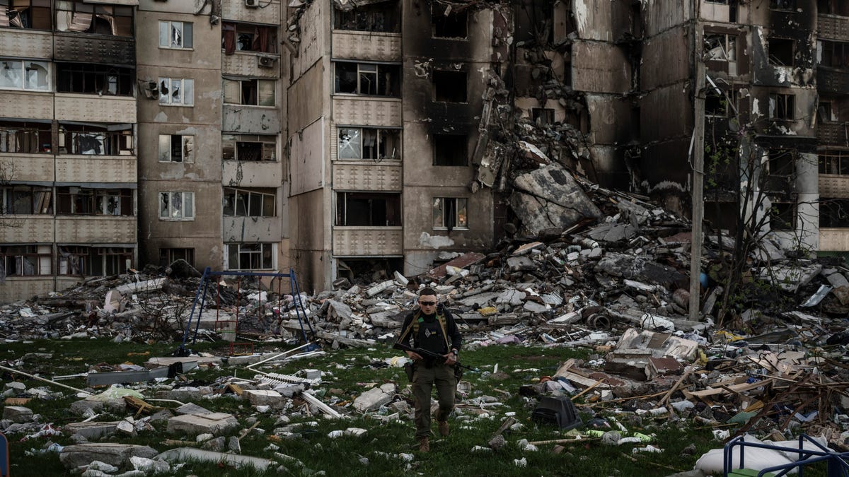 A Ukrainian serviceman walks amid the rubble of a building heavily damaged by multiple Russian bombardments near a frontline in Kharkiv, Ukraine.