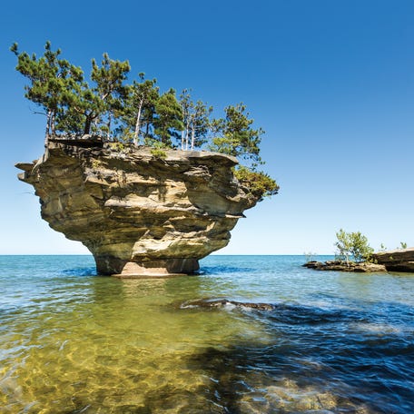 Turnip Rock on Lake Huron in Port Austin Michigan. An underwater view shows rocks under the clear surface of the water