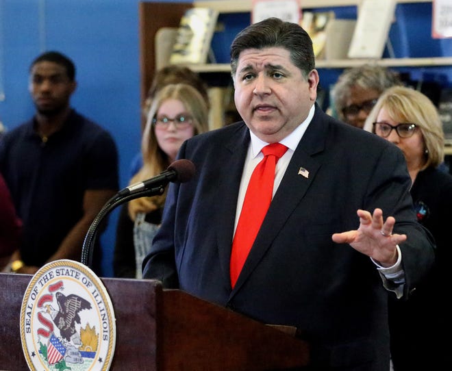 Gov. JB Pritzker answers questions April 27 at at Springfield High School after signing a package of four bills addressing the Illinois teachers shortages. [Thomas J. Turney/The State Journal-Register]
