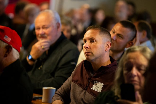 Dave Bell, center, and other members of the Westside Conservative Club listen to candidates running in the Republican primary to represent Iowa's 3rd Congressional District on Wednesday, April 27, 2022, at the Machine Shed in Urbandale, Iowa.