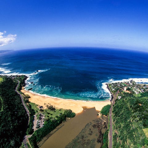 A helicopter view shows the Waimea Bay on the Nort