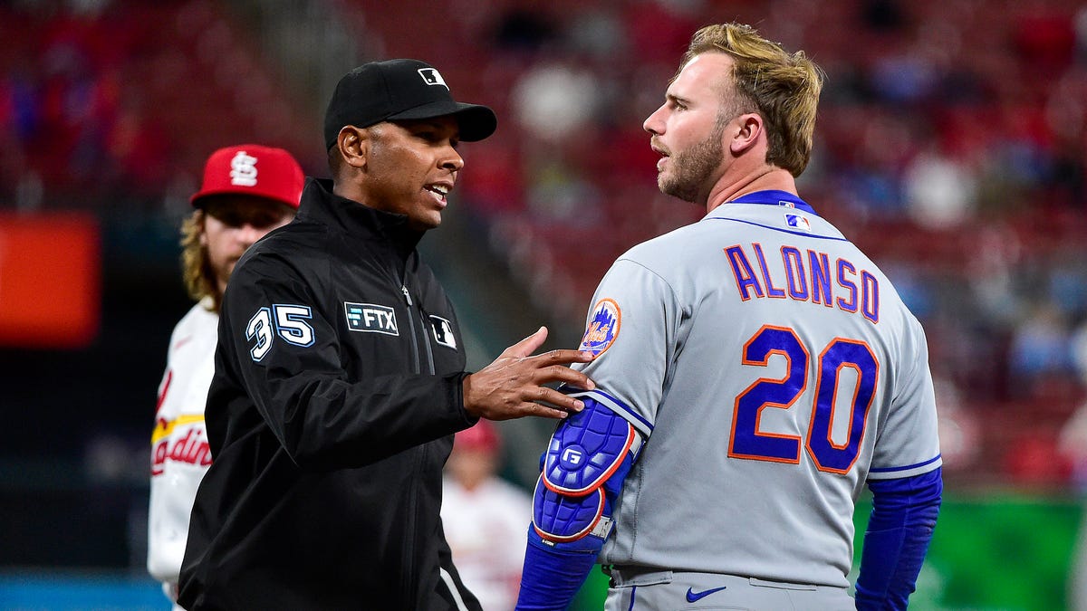 New York Mets designated hitter Pete Alonso reacts after he was hit in the head by a pitch from St. Louis Cardinals reliever Kodi Whitley during the eighth inning at Busch Stadium.