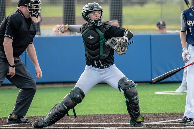 Rock Bridge's Kaiden Stoffer (10) winds up for a throw to second base during the Bruins' 9-0 win over Battle on April 27, 2022, at Battle High School.