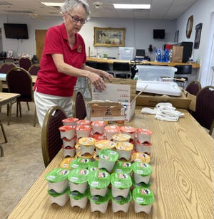 Barbara Edwards, whose grandson is in the U.S. armed forces, helped VFW Post 3282 in Port Orange package goodies that will be sent to sailors and Marines on the USS Harry S. Truman.