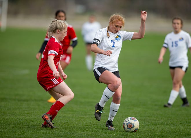 Rockford Christian's Jada Harvey takes control of the ball against Oregon on Wednesday, April 27, 2022, at Oregon High School in Oregon.