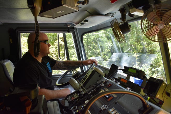Bald Head Island public safety officer Brandon Fuller drives a fire engine around the island on Wednesday, April 27, 2022.