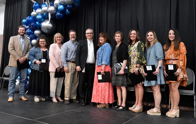 Abilene ISD superintendent David Young (center) stands with recipients of the "Teachers in the Limelight" awards sponsored by the Abilene Education Foundation on Wednesday.