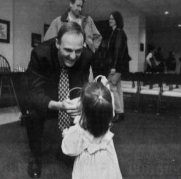 Thad Matta greets his 18-month-old daughter, Ali, in April 2000 after being named Butler's head basketball coach.