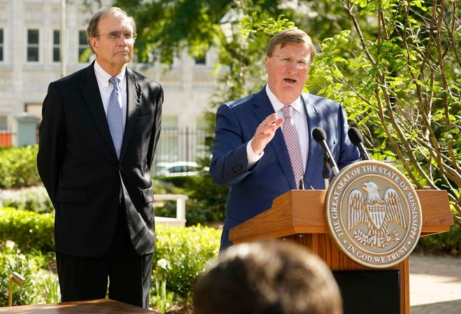 Mississippi Lt. Gov. Delbert Hosemann (left) and Mississippi Gov. Tate Reeves at a bill signing in the Governor's Mansion garden in Jackson, Miss. on April 19, 2022.