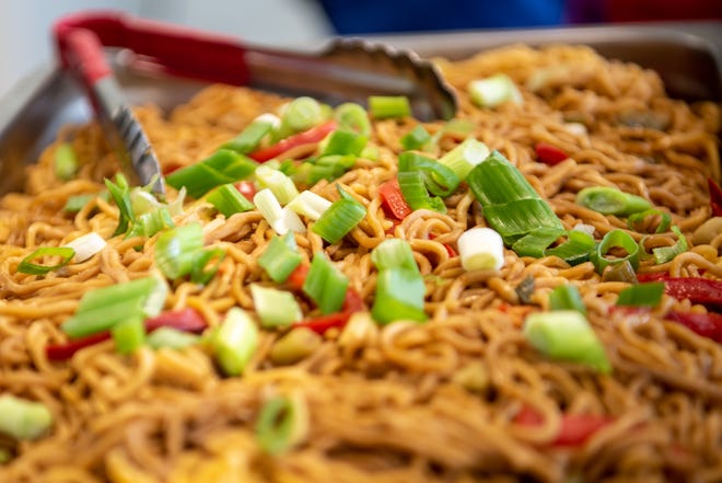 Philip's Academy Charter School in Newark, NJ has lunch provided by Red Rabbit, a company that polls students on the food they eat and like at home, and brings in healthy food that represents the students and their culture into the lunch room. Lo mein noodles are served on Thursday April 28, 2022.