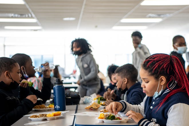 Philip's Academy Charter School in Newark, NJ has lunch provided by Red Rabbit, a company that polls students on the food they eat and like at home, and brings in healthy food that represents the students and their culture into the lunch room. Middle school students eat lo mein noodles with broccoli, chicken and an orange for dessert on Thursday April 28, 2022.