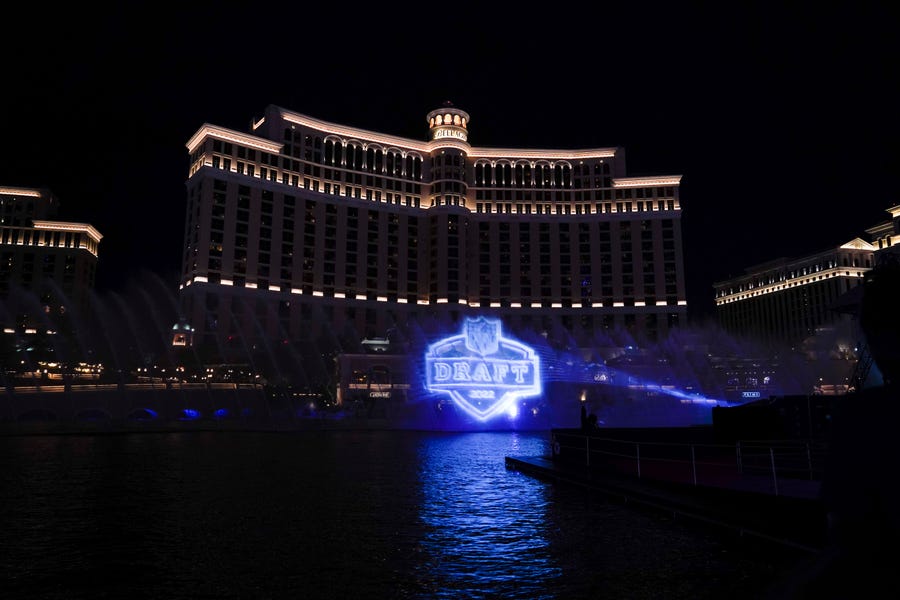 A logo of the 2022 NFL football draft is projected at the Fountains of Bellagio on Wednesday, April 27, 2022, in Las Vegas, the day before the draft.