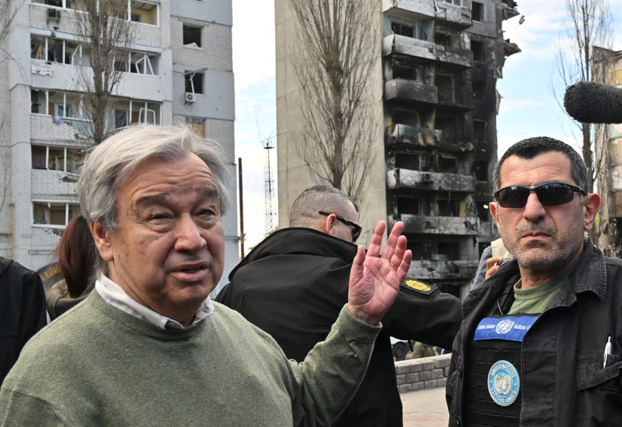 UN Secretary-General Antonio Guterres (L) gestures as he walks during his visit in Borodianka, outside Kyiv, Ukraine, on April 28, 2022.