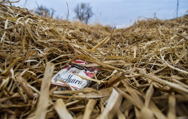 A discarded pack of Marlboro cigarettes lays in a ditch filled with dried grass near Worthing, South Dakota on Thursday, April 29, 2022. Darren Clabo, state fire meteorologist, says the majority of fires in the state, except for the Black Hills, are human-caused.