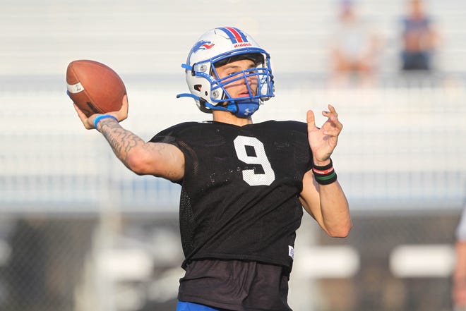 Hutchinson Blue Dragons quarterback Luke Alleman launches a pass Thursday, April 28, 2022 during the Blue Dragons' spring football game at Gowans Stadium in Hutchinson.