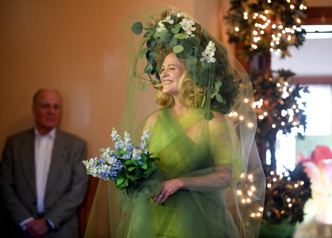 Hilary DiSimone models a fantasy garden sculpture outfit during the Massillon Woman's Club Daffodil Luncheon 2022 Floral Fantasy - The Language of Flowers. The fashion show focused on how flowers represented different emotions during Victorian times.