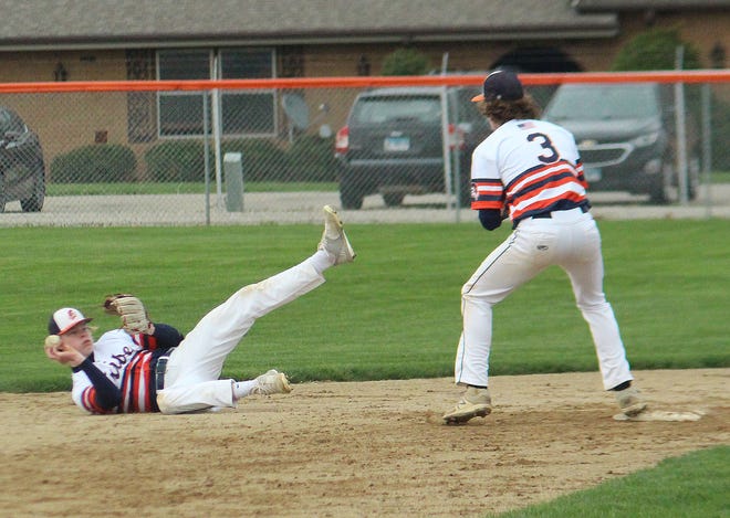 After making a diving stop of a grounder, Pontiac second baseman Tanner Legner flips the ball to shortstop Johnny Lenox for an out in Thursday's 5-1 win over Prairie Central at The Ballpark at Williamson Field.