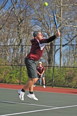 La Salle's Jameson Conlon hits a backhand volley for a winner during his and Rhys Urbec's win at No. 1 doubles in the Rams' sweep of South Kingstown on Friday afternoon.