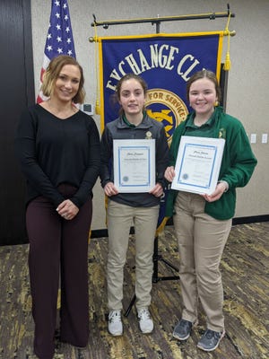 Courtney Hostetter, left, youth chair of the Exchange Club of Aberdeen, presented the February 2022 Youth Citizenship Awards to Roncalli Junior High School eighth grader Claire Crawford and seventh grader Claire Johnson. The award recognizes pre-high school students who daily demonstrate good citizenship both at school and at home. The students are chosen by their teachers and counselors.