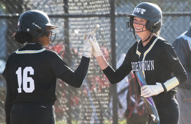 Bordentown's Brianna Fischer, right, is congratulated by teammate Kaci Benton after Fischer scored a run during the 5th inning of the softball game between Bordentown and Kingsway played at Kingsway Regional High School in Woolwich Township on Thursday, April 28, 2022.  Bordentown defeated Kingsway, 5-3.