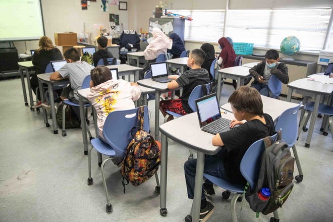 Sergio Marquez’s sixth-grade students take a test on their laptops at Lynn Community Middle School on Friday, April 29, 2022. 